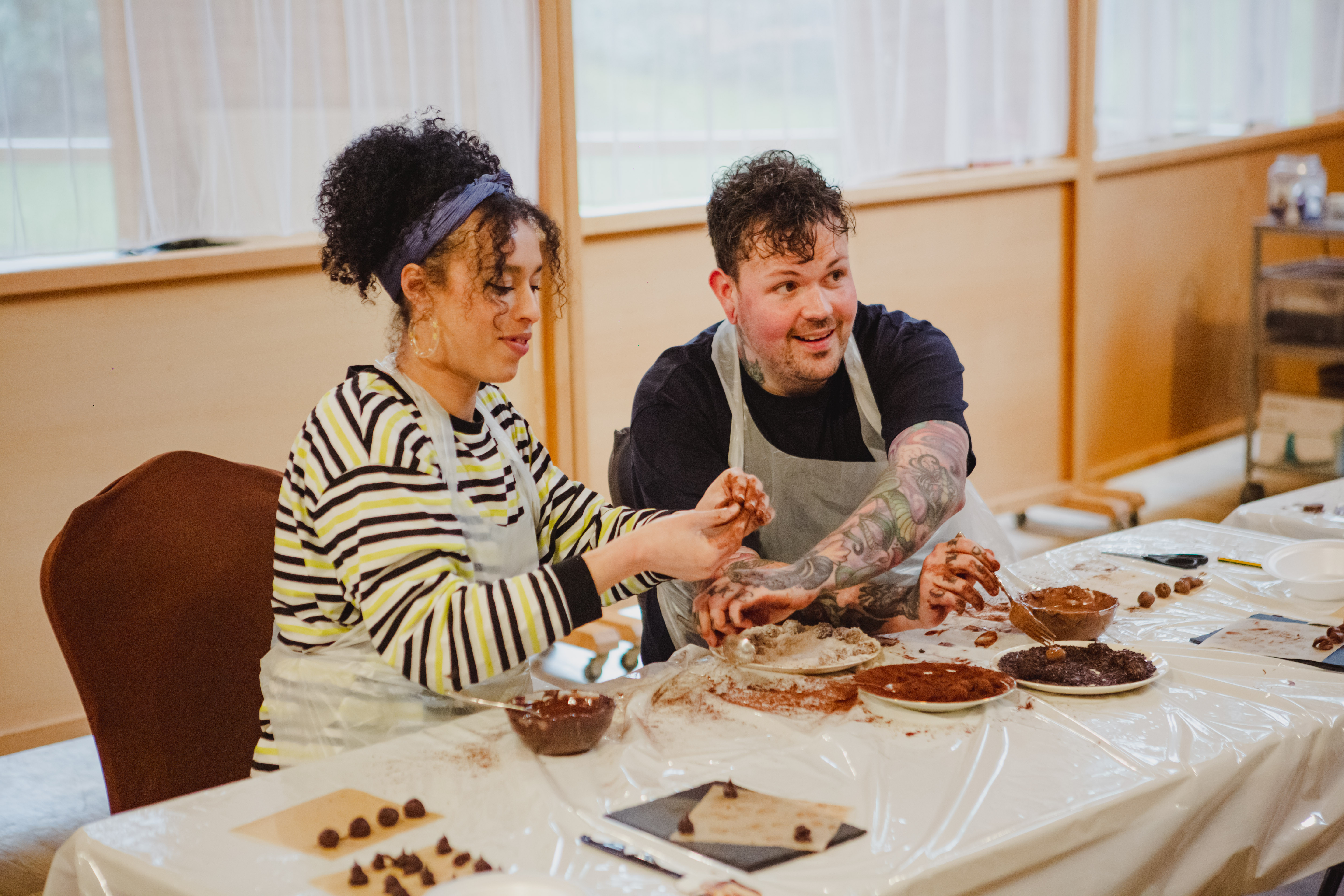 Couple's night of hand rolling chocolate truffles in a class.